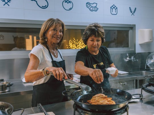 Paella cooking class with central market tour